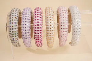 Close-up of set of six wide sponge headbands with colorful square rhinestones and shimmer