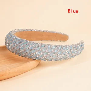 Detail of light blue rhinestone headband with padded sponge base and anti-slip lining