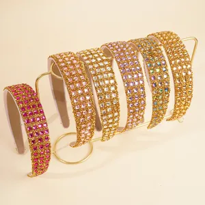 Detail of luxury rhinestone headbands in six colors on a gold display stand
