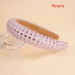 Close-up detail of purple square rhinestones on a thick padded sponge headband