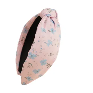 Vintage-Haarreif mit Blumenmuster und Knoten-Design in zartem Rosa mit blauen Blüten