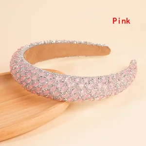 Detail of pink rhinestone padded headband with sparkling crystals and silver glitter base