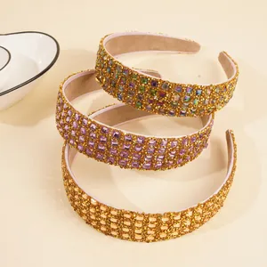 Detailed view of three luxury rhinestone headbands with colorful crystal embellishments
