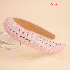 Detailed close-up of a pink rhinestone headband with padded sponge and square gems
