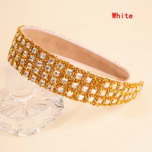 Close-up of luxury wide headband with white rhinestones and soft inner lining