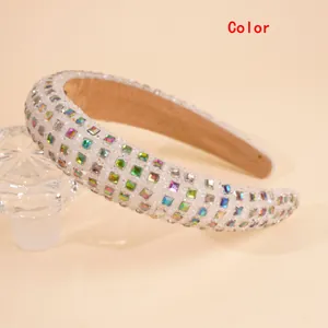 Macro shot of thick headband with sparkling multi-color rhinestones and velvet lining