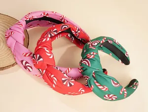 Set di tre cerchietti natalizi con stampa di bastoncini di zucchero in rosa, rosso e verde morbido