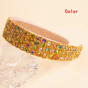 Detailed view of luxury wide headband featuring multi-color crystals and gold beadwork