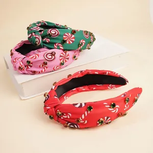 Set of three Christmas knot headbands with candy cane prints and sparkly rhinestones