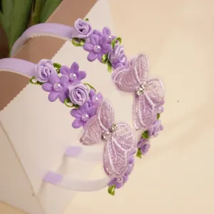 2-piece purple kids headband set with lace butterflies, fabric flowers, and pearls