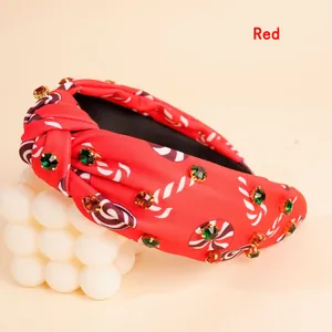 Detail of red knotted headband with candy print and sparkling colorful rhinestones
