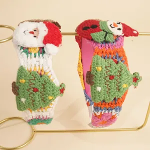 Handmade crochet Christmas headband set featuring 3D snowman and festive tree patterns