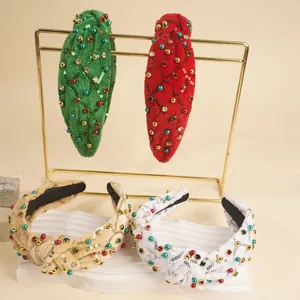 Détail de serre-têtes noués de Noël avec strass et paillettes festives en plusieurs couleurs