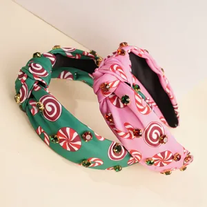 Knotted Christmas headbands with rhinestone accents and candy prints in pink and green