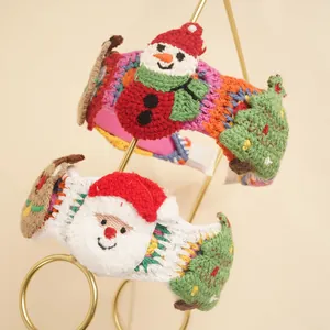 Detail of handmade crochet Christmas headband featuring 3D snowman and reindeer designs