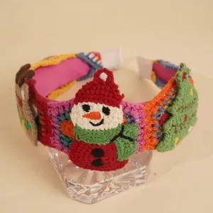 Detail of crochet Christmas headband with 3D snowman, reindeer and festive tree ornaments