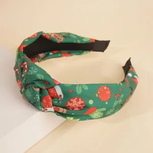 Serre-tête de Noël noué en tissu vert foncé avec motifs festifs de rennes et flocons de neige