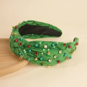 Serre-tête en velours vert noué avec paillettes et perles colorées festives