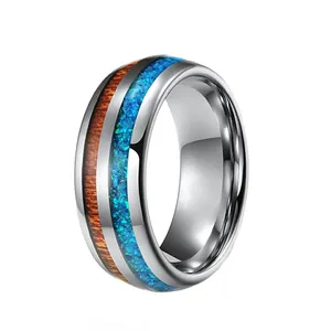 Polished tungsten steel ring with wood grain and vibrant blue opal inlay detail
