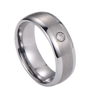 Mens silver tungsten ring with brushed matte finish and single sparkling diamond