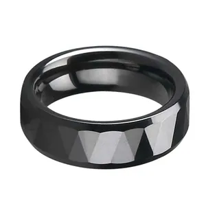 Men's minimalist black ceramic ring with multifaceted geometric surface and polished interior