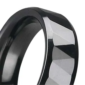 Men's black ceramic ring featuring a geometric multi-faceted cut design and polished finish