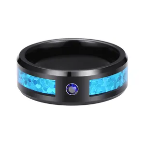 Black tungsten ring for men featuring a blue opal inlay and a centered blue diamond