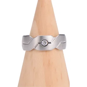 Brushed silver tungsten ring featuring geometric diagonal lines and a round center stone