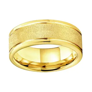 Macro shot of gold tungsten ring with brushed matte center and polished edges contrast