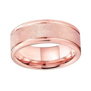 Macro detail of rose gold tungsten ring featuring sandblasted center and polished edges