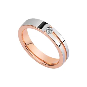 Minimalist two-tone tungsten ring in rose gold with a centered round diamond setting