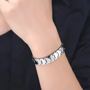 Macro shot of silver tungsten men bracelet with geometric arrow links worn on a wrist