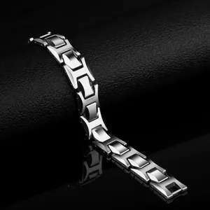 Men's fashion tungsten steel bracelet with polished H-shaped links on a premium display