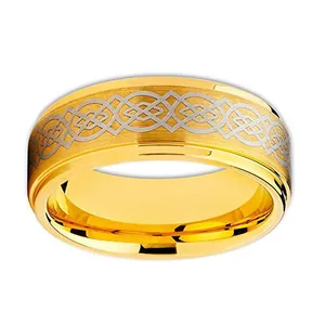 Detail of golden tungsten ring featuring a laser-cut Celtic knot inlay and brushed finish