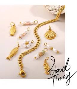 Macro shot of gold stainless steel DIY ocean charms including seahorse, shell and pearls