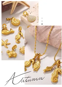 Detailed close-up of 18K gold plated ocean pendants featuring seahorse and shell designs