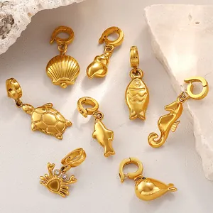 Set of 8 gold-plated ocean-themed charms featuring sea creatures with secure lobster clasps
