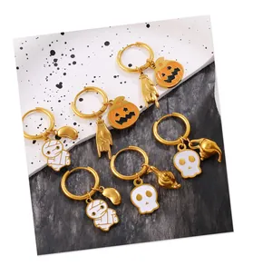 Detailed macro of 18K gold plated hoop earrings with Halloween enamel charms