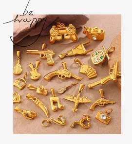 Detailed close-up of golden vintage-style charms featuring musical instruments and cameras