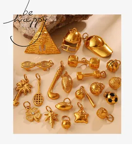 Macro shot of assorted gold sports-themed alloy charms on a natural stone base
