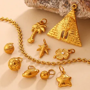 Golden pyramid and sports themed charms collection on natural stone background