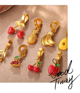 Macro view of colorful enamel fruit charms including apple and pineapple with spring clasps