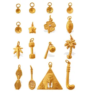 Golden metal sports and nature charms including basketball pyramid and palm tree pendants