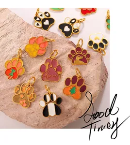 Macro detail of colorful dog paw enamel pendants with love and dog mom engravings