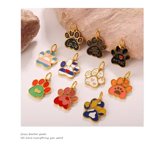 Detail of colorful dog paw enamel pendants with heart patterns and Love engravings