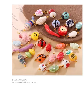 Detailed view of colorful handmade ceramic charms like ladybugs and shells for DIY jewelry