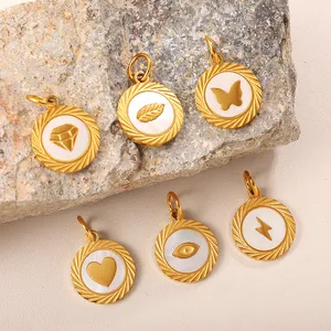 Set of six gold-plated pendants with shell inlay featuring heart, leaf, and butterfly motifs