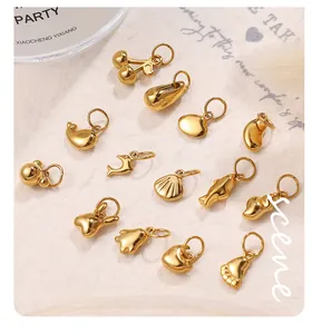 Detailed view of polished gold stainless steel pendants in heart and animal shapes