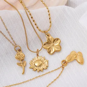 Golden stainless steel necklace set featuring vintage floral and butterfly charm pendants