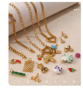 Macro view of gold-plated charms including unicorn, bear and heart shapes on necklaces